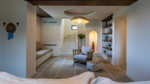 Lounge area with library at Sagehill Stonehouse, Messinia