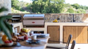 Garden BBQ facilities at Sagehill Stonehouse with outdoor dining area